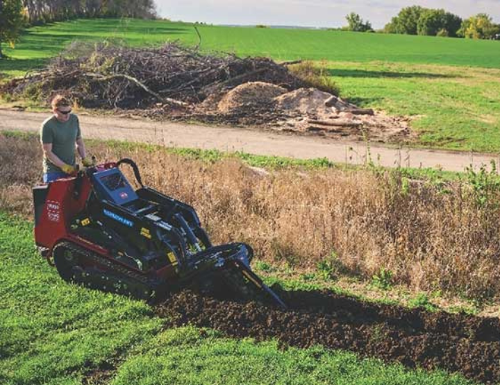 Man digging row with Dingo