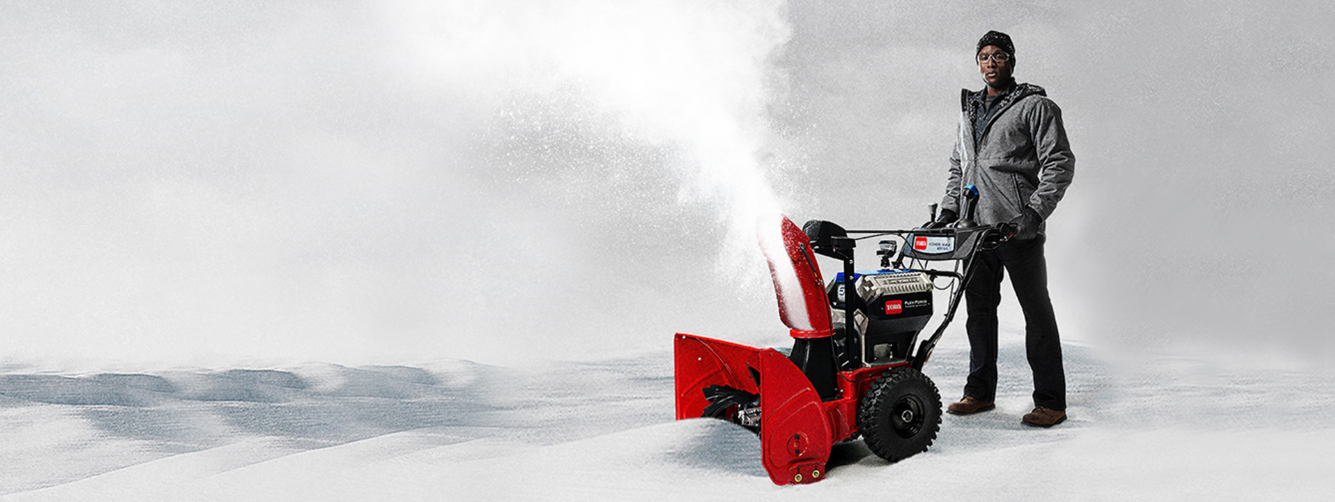 Man with Toro snow blower 39926 blowing snow