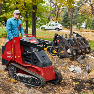 Dingo TX 700 with a grapple rake attachment