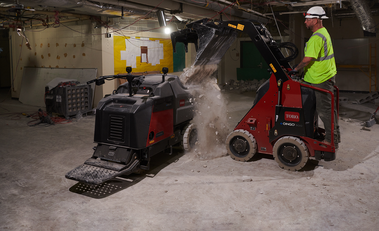 eDingo 500 dumping material into the electric Ultra Buggy